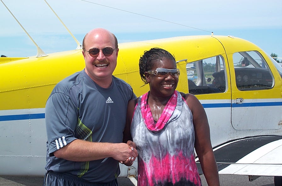 Dave Parry and Alexis Jeffery after Alexis's First Solo, June, 2008, Langley Flying School. 